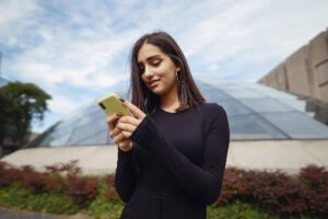 girl is using his mobile phone